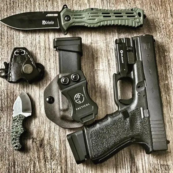 EDC flat-lay: Glock 19, spare magazine, tactical flashlight and folding knife on canvas