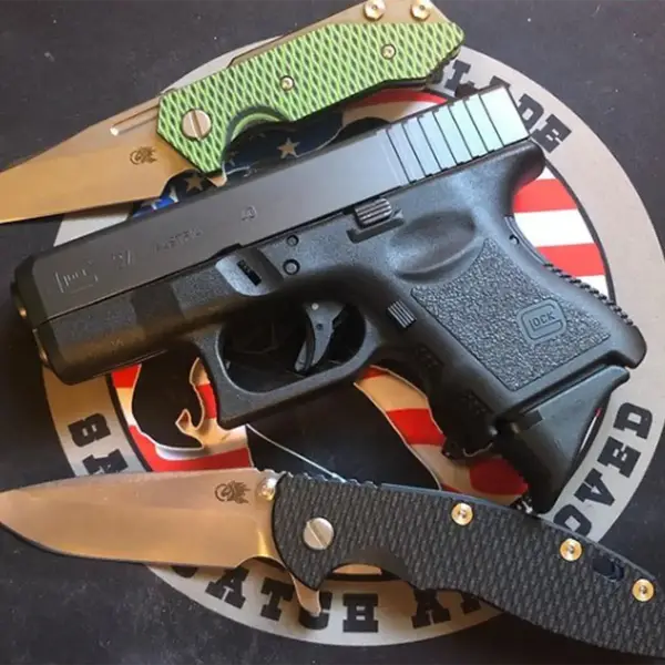 Rear top view Glock 27 highlighting combat sights and textured backstrap