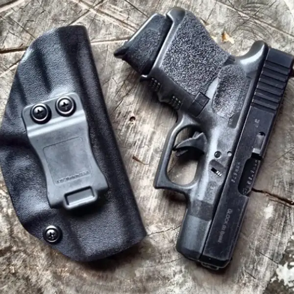 Left-side profile Glock 28 with “.380 Auto” engraving and forward serrations