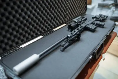 14.5 mm Ammunition Logistics hard-case with secured anti-materiel sniper rifle, shock-isolated foam.