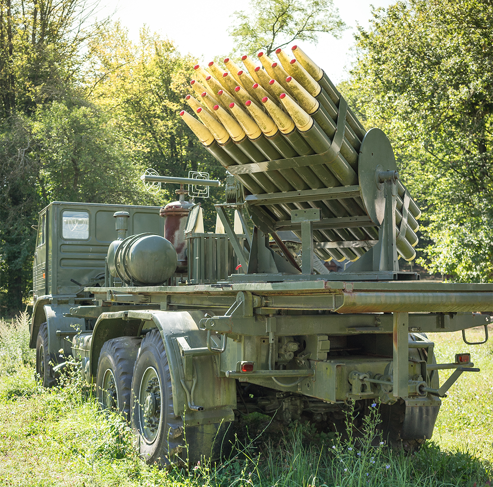 Multiple launch rocket system on a truck chassis; representative visual for air defense system content.