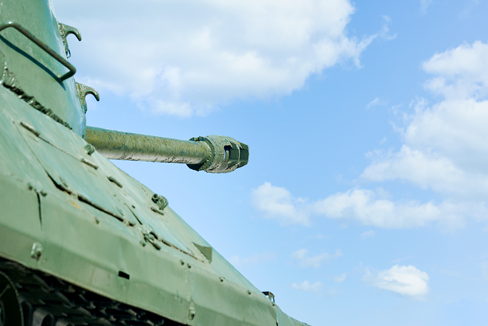 Upward-pointing tank barrel; representative image in an integrated air defense system context.